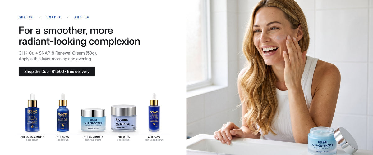 Woman applying Biolabs GHK-Cu + SNAP-8 Renewal Cream at a bathroom mirror